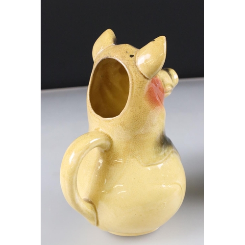 4 - Goebel Lion stood on a rocky outcrop, model 36 019 25, 47cm long together with a Novelty ' Bunny ' T... 