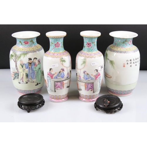 54 - Two Pairs of 20th century Chinese Famille Rose Vases, both decorated with figures and with red chara... 
