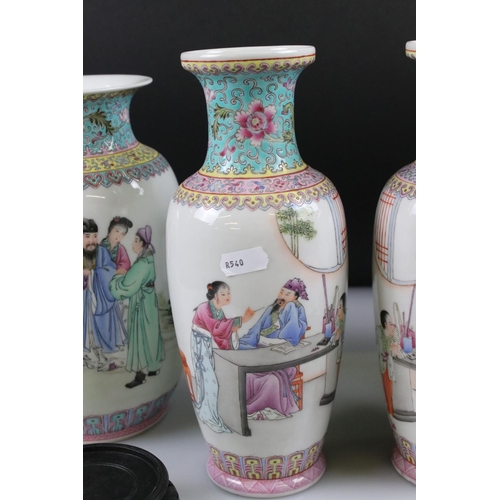 54 - Two Pairs of 20th century Chinese Famille Rose Vases, both decorated with figures and with red chara... 