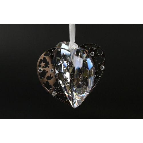 57 - Six Boxed Swarovski items including Spiral Shell, Starfish, Christmas Hear Ornament, Heart Two Daisi... 