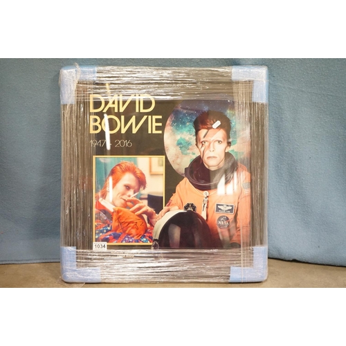 1034 - Memorabilia / Autographs - David Bowie - Framed and glazed picture of David Bowie signed and dated '... 