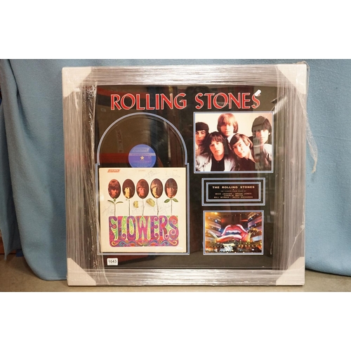 1043 - Memorabilia /Autograph - Framed and glazed Rolling Stones display featuring a signed copy of Flowers... 