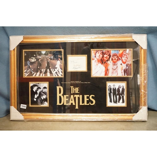 1044 - Memorabilia - Framed & glazed Beatles display featuring a piece of card bearing signatures John Lenn... 