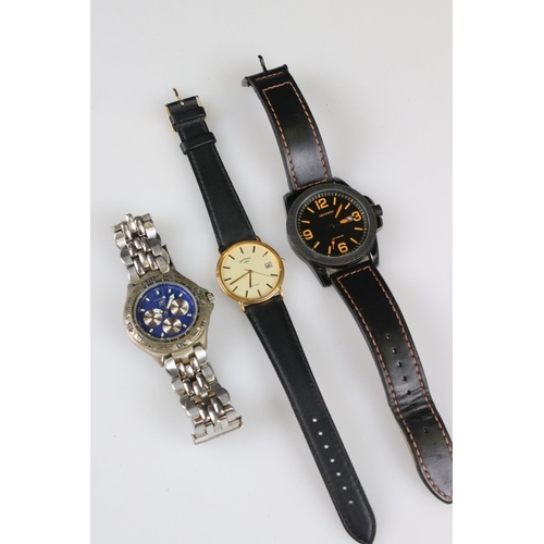 236 - A small collection of three gents watches to include Sekonda, Rotary and Fossil examples.