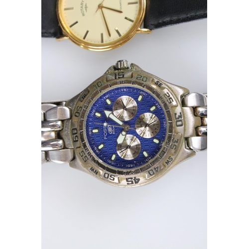 236 - A small collection of three gents watches to include Sekonda, Rotary and Fossil examples.