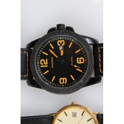 236 - A small collection of three gents watches to include Sekonda, Rotary and Fossil examples.