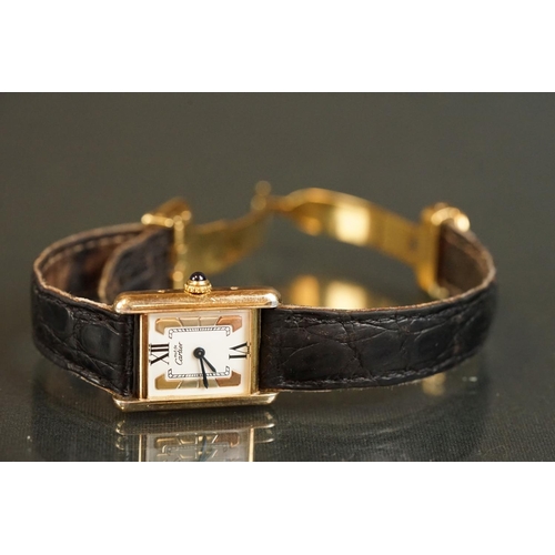 371A - Must de Cartier tank vermeil silver gilt wristwatch, cream dial with black Roman numerals and gilt b... 