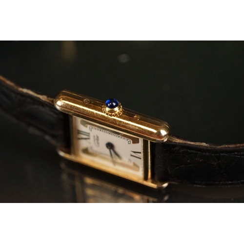 371A - Must de Cartier tank vermeil silver gilt wristwatch, cream dial with black Roman numerals and gilt b... 