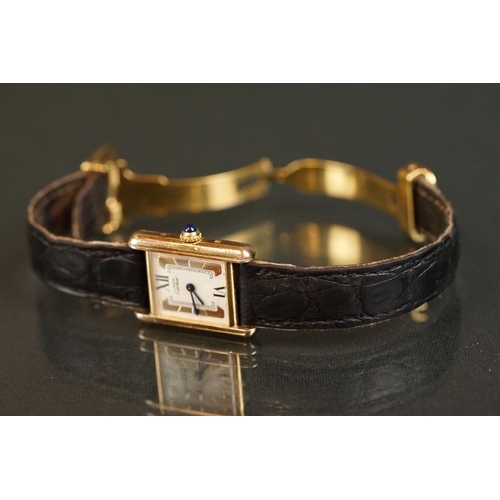 371A - Must de Cartier tank vermeil silver gilt wristwatch, cream dial with black Roman numerals and gilt b... 