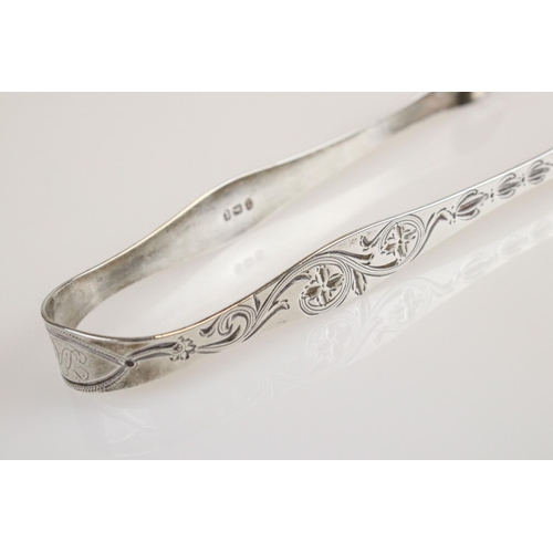 463 - Pair of George III silver sugar tongs, floral and foliate scroll engraved and prick decoration, engr... 