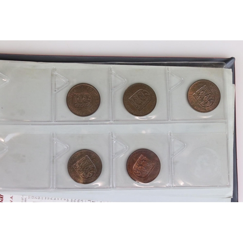 188 - A large collection of mainly foreign coins contained within three collectors albums.