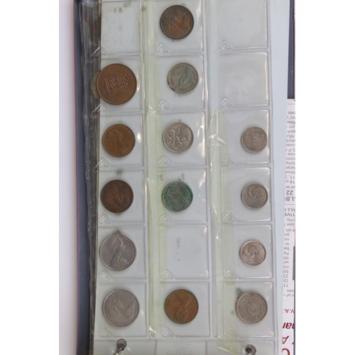 188 - A large collection of mainly foreign coins contained within three collectors albums.