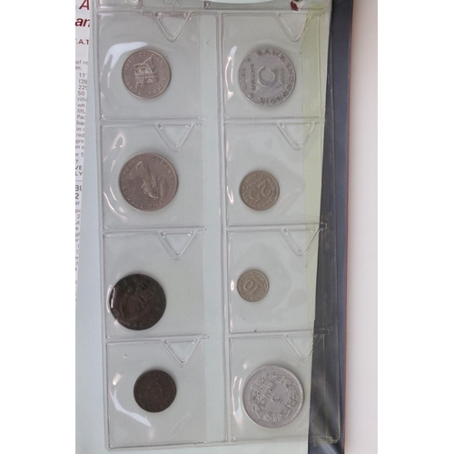 188 - A large collection of mainly foreign coins contained within three collectors albums.