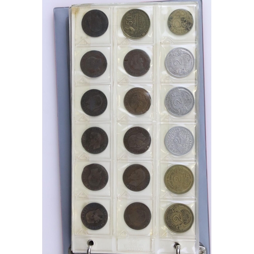 188 - A large collection of mainly foreign coins contained within three collectors albums.