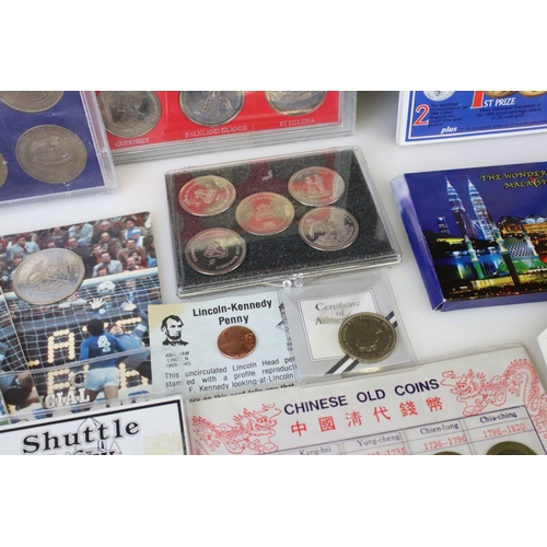 194 - A collection of mixed British and Foreign coins to include proof sets, commemorative coins...etc.