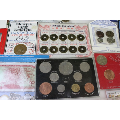 194 - A collection of mixed British and Foreign coins to include proof sets, commemorative coins...etc.