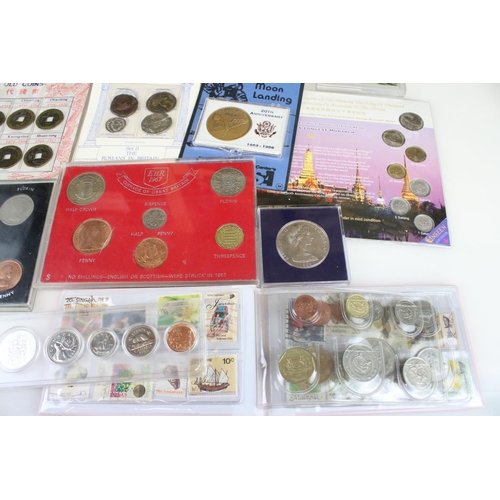 194 - A collection of mixed British and Foreign coins to include proof sets, commemorative coins...etc.