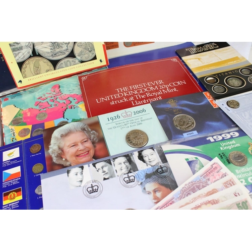 195 - A collection of mixed British and Foreign coins to include proof sets, banknotes, stamp covers and c... 