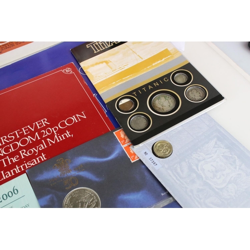 195 - A collection of mixed British and Foreign coins to include proof sets, banknotes, stamp covers and c... 