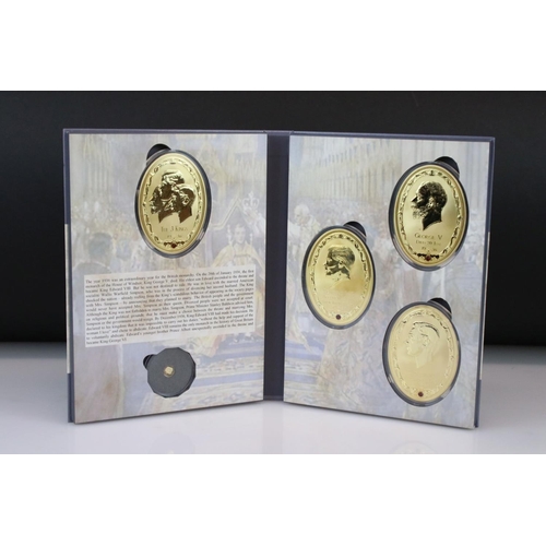 200 - A 1936 Year of the Three King coin set to include four large gold plated medallions together with a ... 