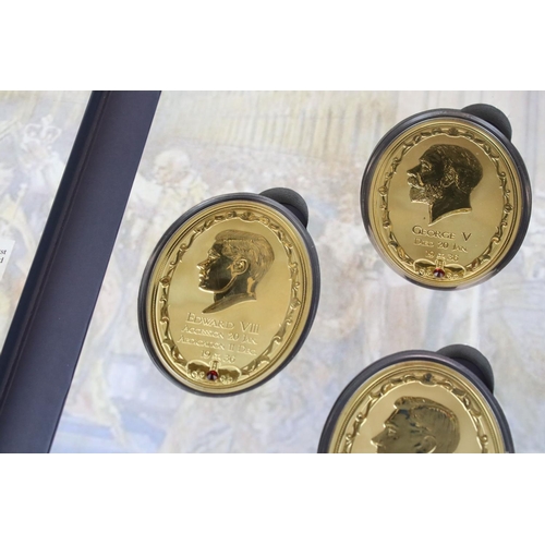 200 - A 1936 Year of the Three King coin set to include four large gold plated medallions together with a ... 