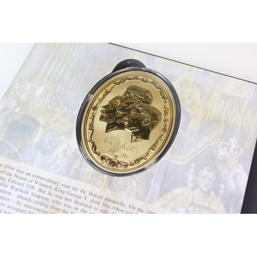 200 - A 1936 Year of the Three King coin set to include four large gold plated medallions together with a ... 