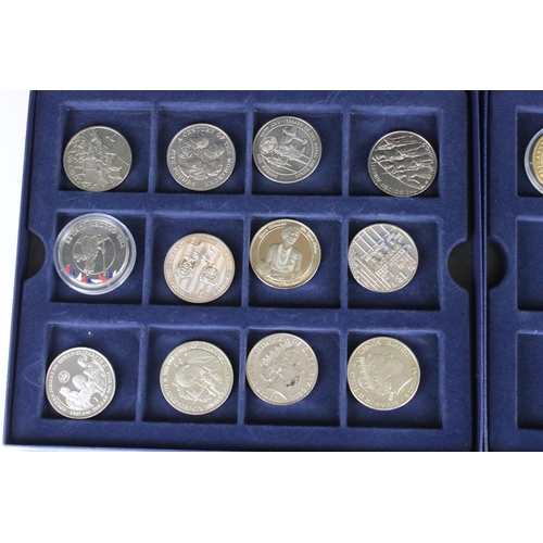 34 - A small collection of commemorative crowns and five pound coins.