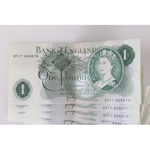 52 - A collection of ten Bank of England One Pound uncirculated banknotes, a complete ten note number run... 