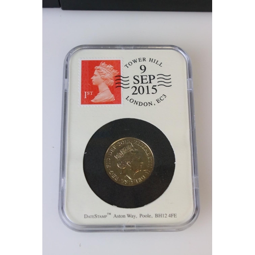 61 - A collection of date stamped slab mounted coins to include a cased 2016 £2 coin, a cased 2019 50p co... 