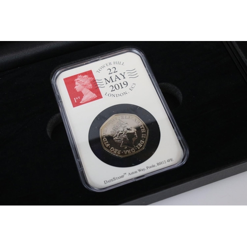 61 - A collection of date stamped slab mounted coins to include a cased 2016 £2 coin, a cased 2019 50p co... 