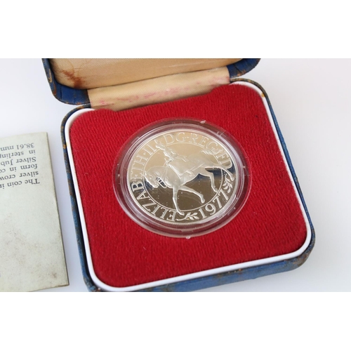 64 - A collection of three cased silver proof coins with COA's to include a Royal Mint 1977 silver proof ... 