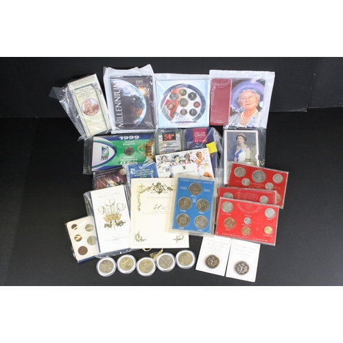 222 - A collection of mainly British Royal Mint uncirculated coin sets to include Crowns, five pound coins... 