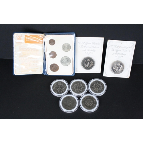 222 - A collection of mainly British Royal Mint uncirculated coin sets to include Crowns, five pound coins... 