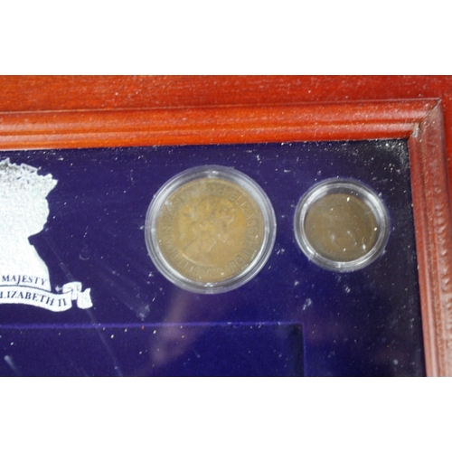 208 - A Danbury Mint 'Her Majesty Queen Elizabeth II' coin and banknote set mounted within wood and glass ... 