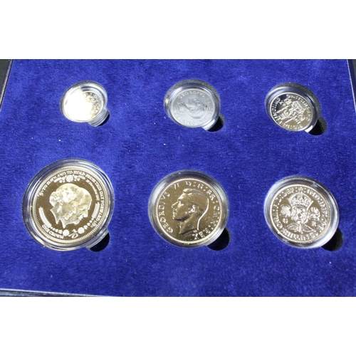 213 - A collection of mixed commemorative and collectors coin sets to include The 1947 Royal Wedding prest... 