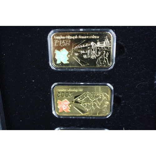 44 - A London Mint Office London 2012 Olympics coin and silver layered ingot set together with a London M... 