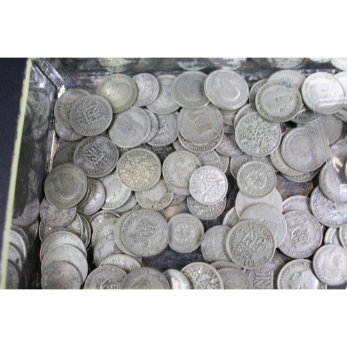 60 - A collection of British sixpence and threepence silver coins to include King George V and King Georg... 