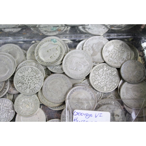 60 - A collection of British sixpence and threepence silver coins to include King George V and King Georg... 