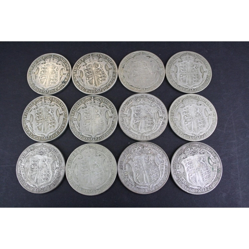 66 - A collection of twelve British King George V pre 1947 silver half crown coins.