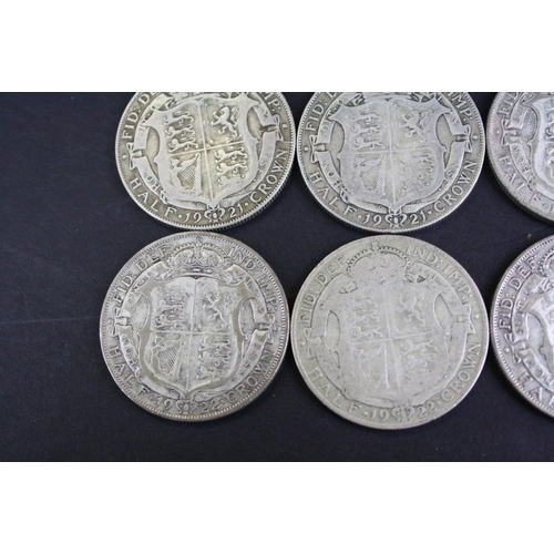 66 - A collection of twelve British King George V pre 1947 silver half crown coins.