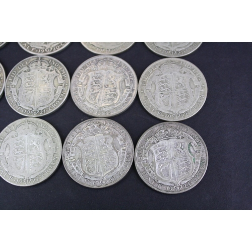 66 - A collection of twelve British King George V pre 1947 silver half crown coins.