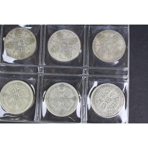 67 - A collection of thirty British King George V pre 1947 silver florin coins