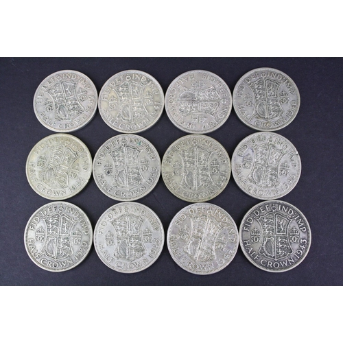 68 - A collection of twelve British King George VI pre 1947 silver half crown coins.