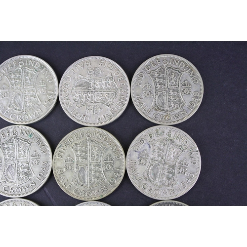 68 - A collection of twelve British King George VI pre 1947 silver half crown coins.