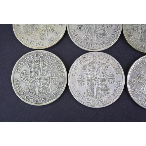 68 - A collection of twelve British King George VI pre 1947 silver half crown coins.