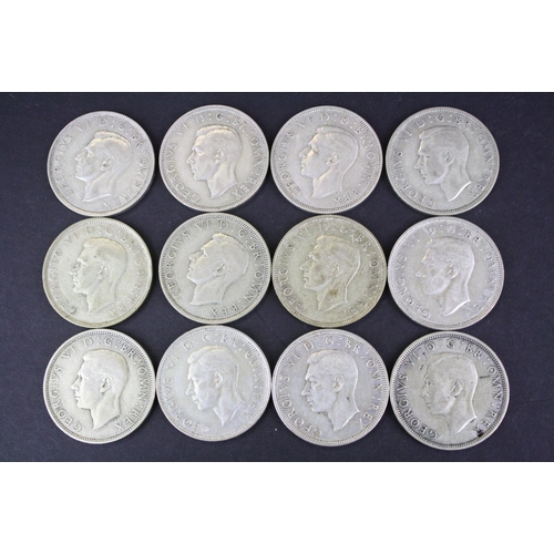 68 - A collection of twelve British King George VI pre 1947 silver half crown coins.