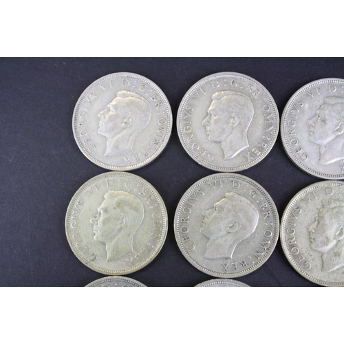 68 - A collection of twelve British King George VI pre 1947 silver half crown coins.