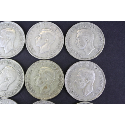 68 - A collection of twelve British King George VI pre 1947 silver half crown coins.