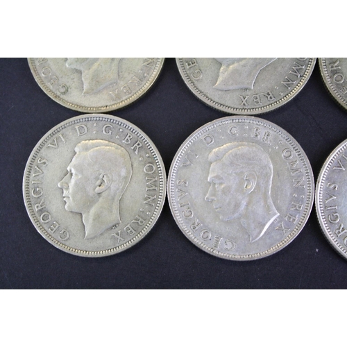 68 - A collection of twelve British King George VI pre 1947 silver half crown coins.