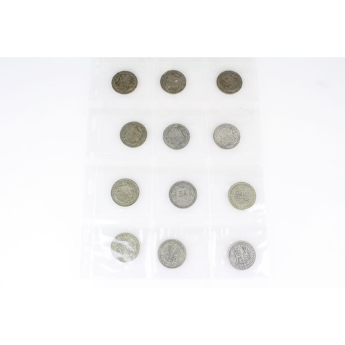 70 - A collection of twelve British King George V pre 1947 silver half crown coins.